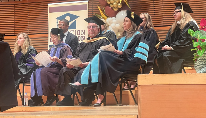 Photo showing Operation Graduation with LACOE leaders on stage